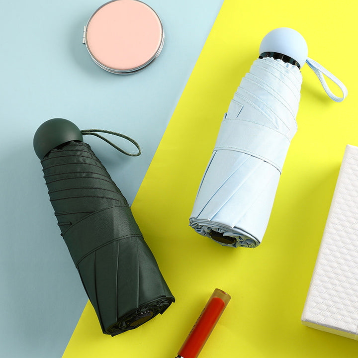 Mini Compact Capsule umbrella windproof 4 folding UV for travel and car (Multicolor)